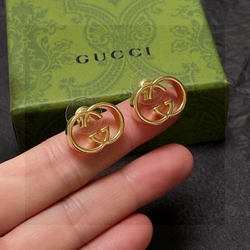 G*u*i earrings